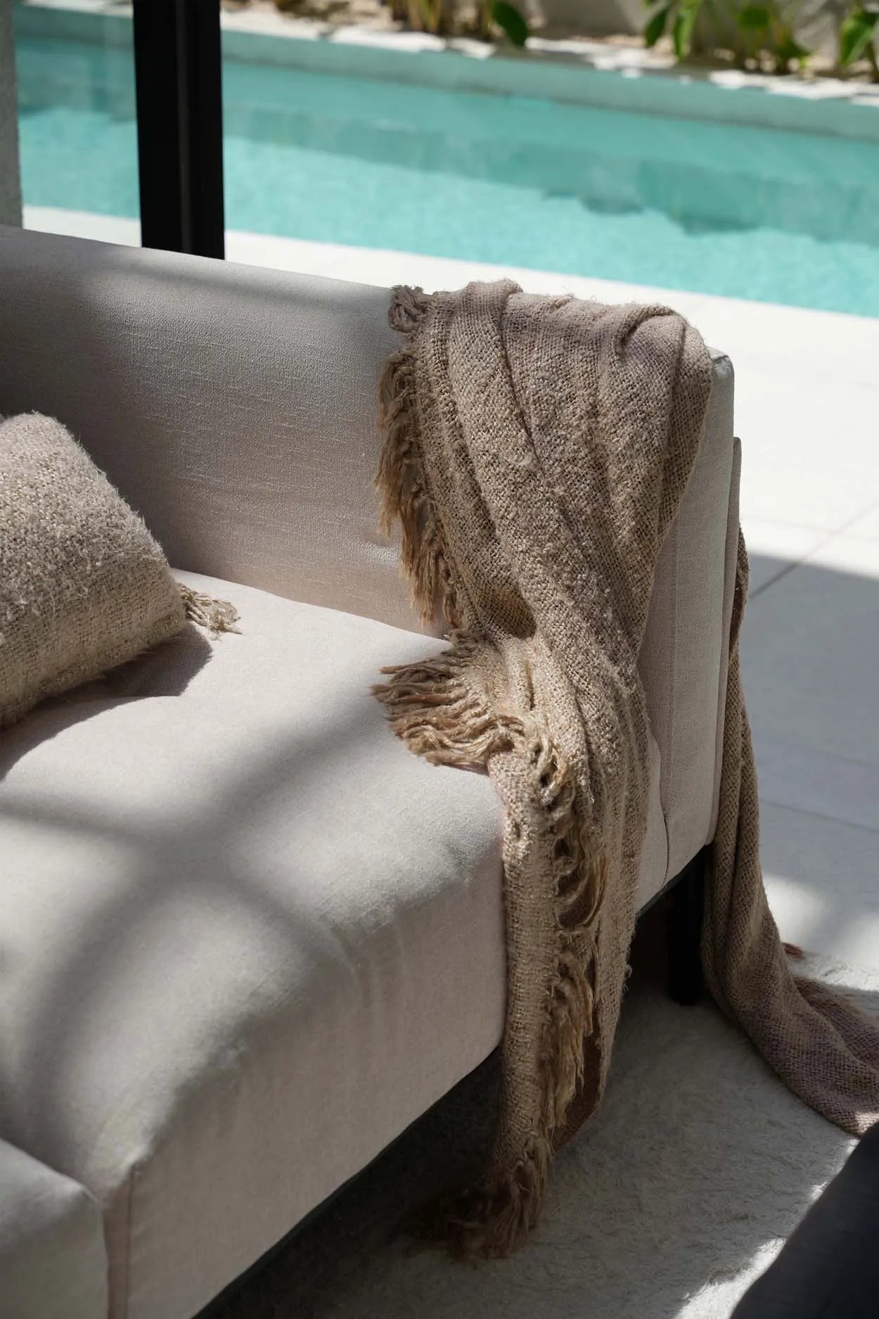 "The s'il vous Plaid - Beige" translates to "The 'if you please' Plaid - Beige"