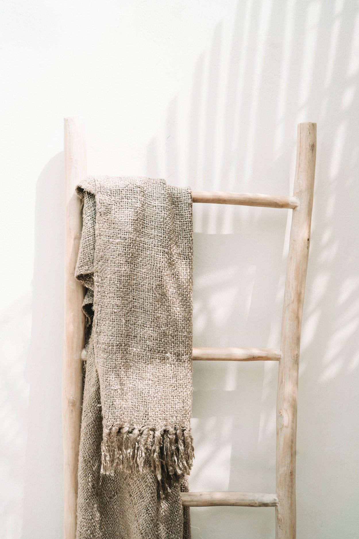 "The s'il vous Plaid - Beige" translates to "The 'if you please' Plaid - Beige"